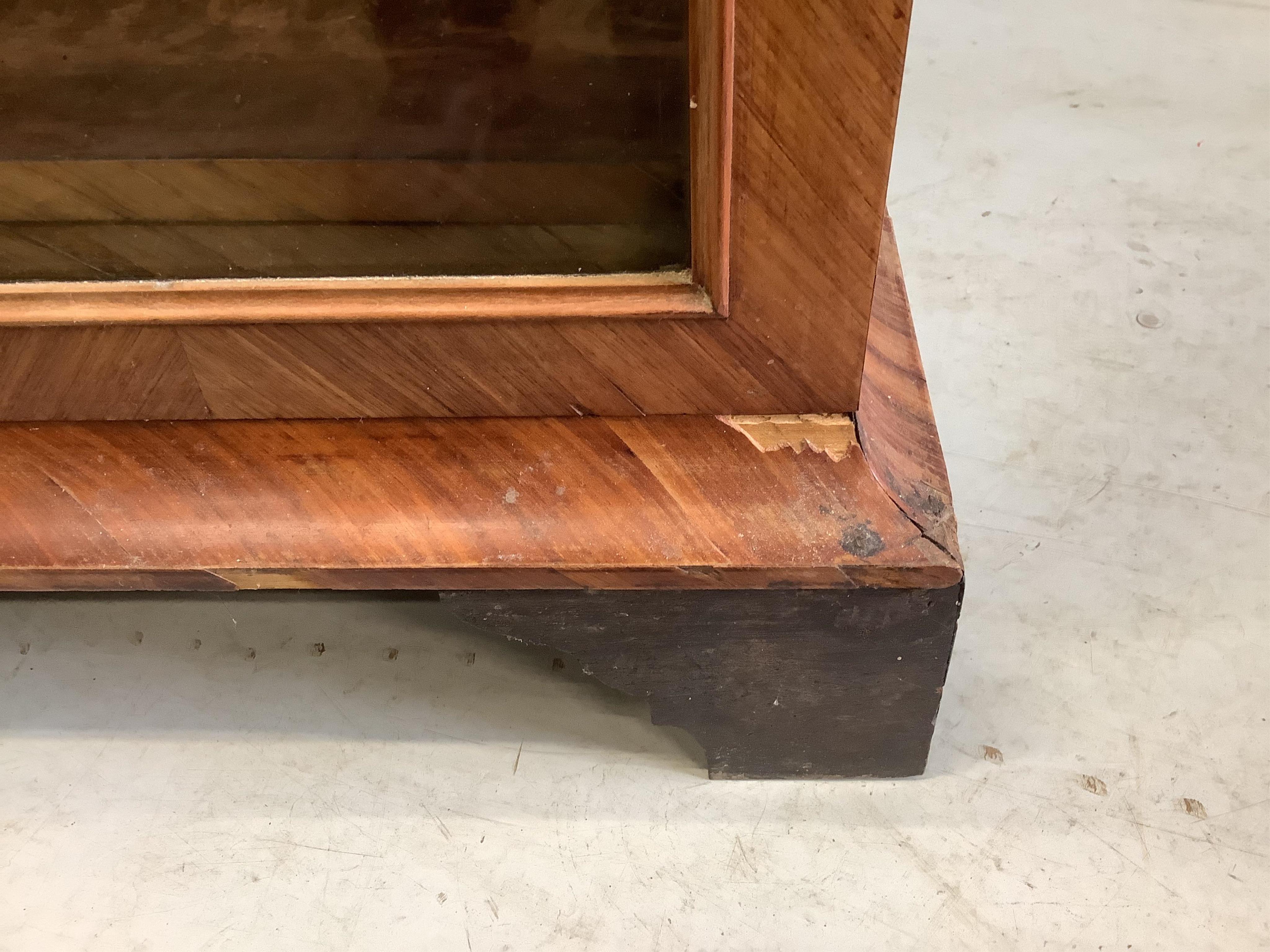 A large 19th century glazed kingwood bookcase, fitted four hinged doors and three adjustable shelves, width 190cm, depth 36cm, height 145cm. Condition - poor